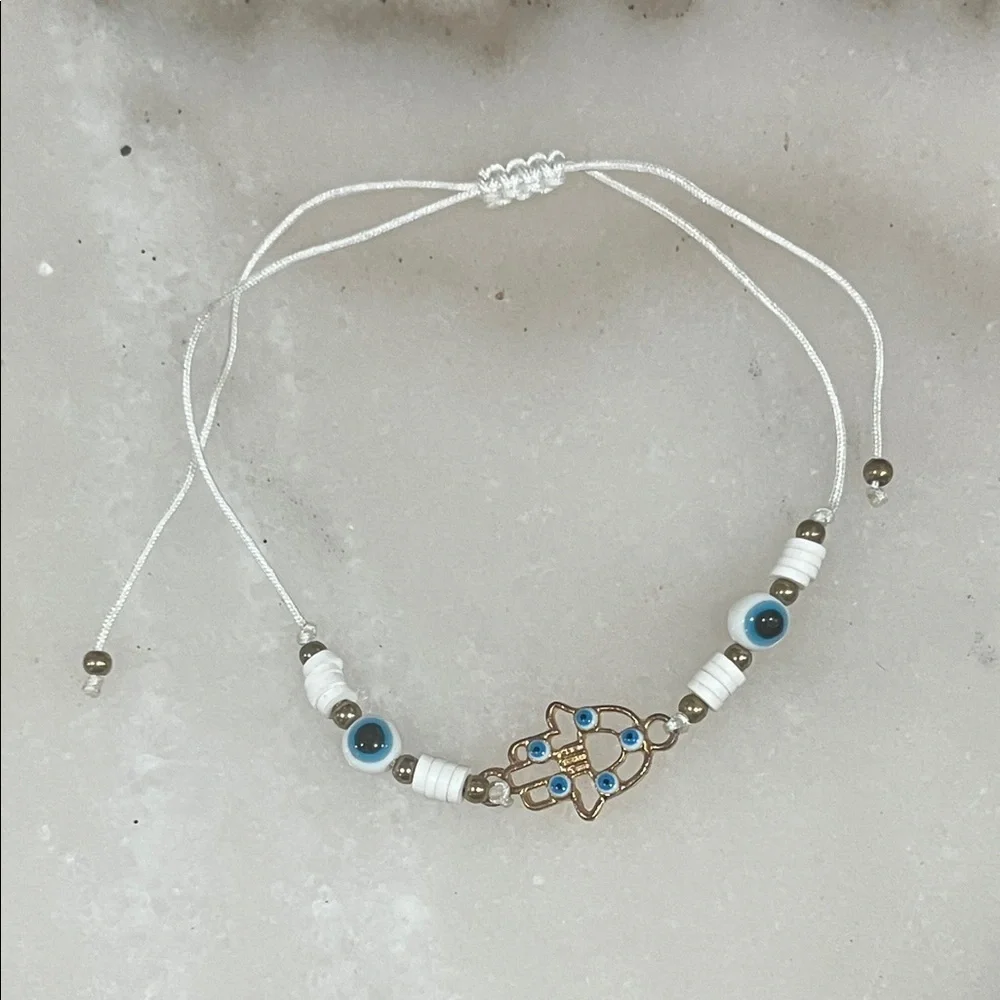 Chic Gold and White Hamsa Bracelet with Blue Accents